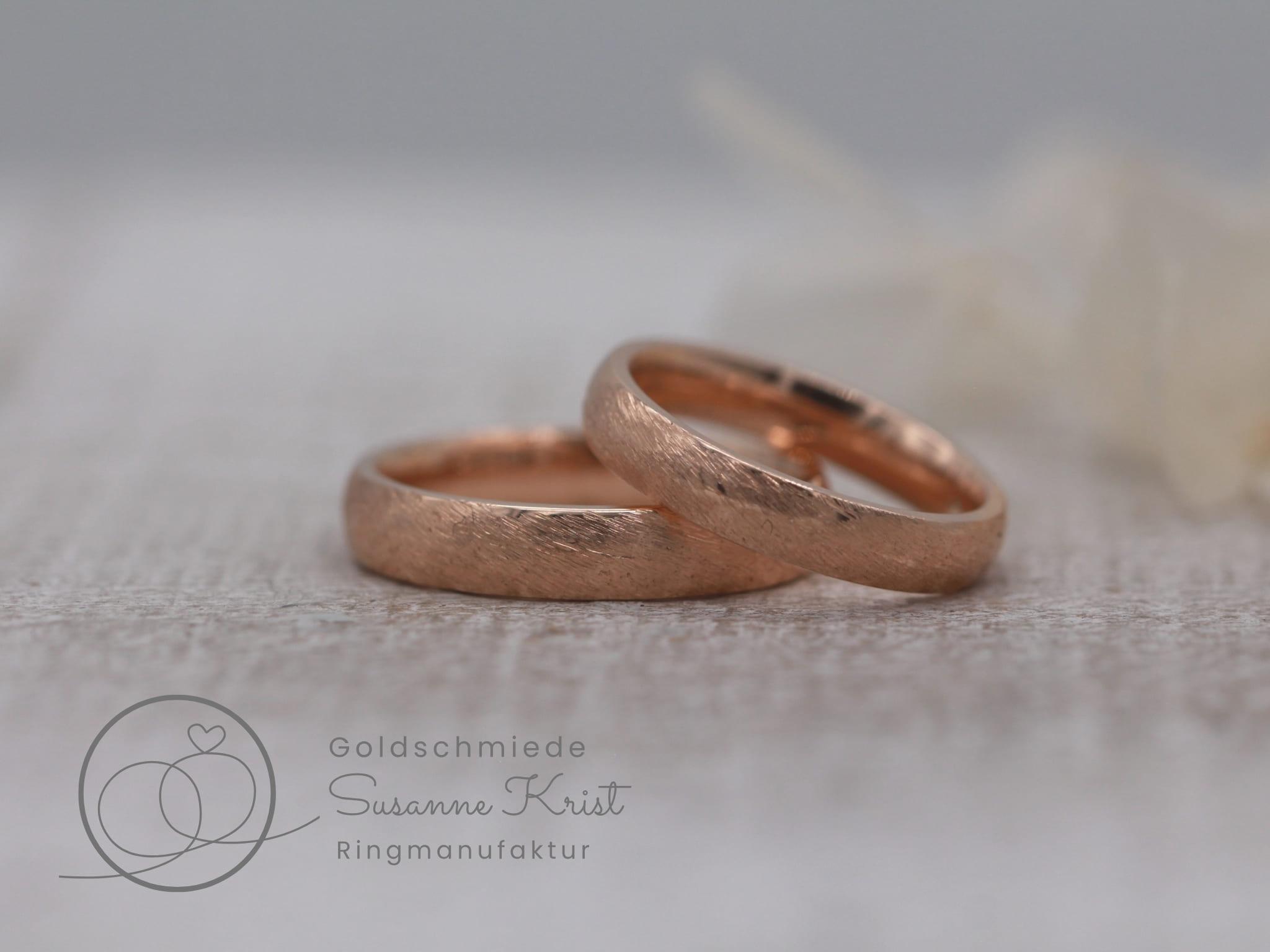 Rote Eheringe aus Rotgold mit Düneschliff